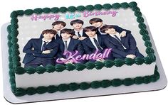 a birthday cake with an image of the band's members on it