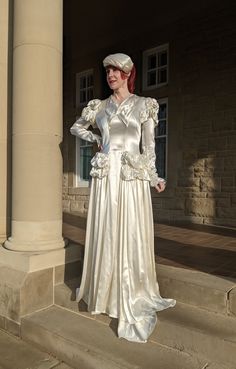 "Unique and amazing Vintage Late 1930s to 1940s Light Ivory Candlelight Satin Wedding Gown with high drama ruchy ☁️ details on sleeves and at hips! Fastness down back with covered buttons to waist then hooks and thread loops to fasten \"bustle effect\" back skirt. Hidden finger loop on underside of train  Approximate Measurements of Garment (laid flat): Bust: 37\" at rest, but goes to 38\" Natural waist: 30\" Dropped waist above ruched details: 32\" Hips: mid ruffles: 40\", full below that Lengt Art Deco Clutch, Vintage Eye Glasses, Rose Gown, Informal Weddings, Satin Wedding Gown, Lace Pocket, Back Skirt, Sporty Dress, Amazing Lace