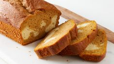 sliced loaf of bread sitting on top of a cutting board