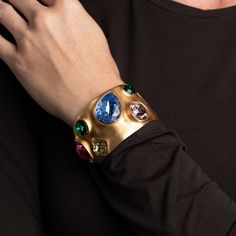 Product Description: Brightly colored gems shine on a gold statement hinged cuff. Pair with our Pastel Gemstone Collar Necklace.  Style Number: 4573BGMP Gold Collar Necklace, Colorful Stones, Gold Pin, Gold Satin, Gold Cuffs, Crystal Stars, Colored Gems, Shine On, Kenneth Jay Lane