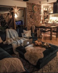 a living room filled with furniture and a laptop computer