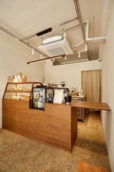 the inside of a coffee shop with wooden counter tops