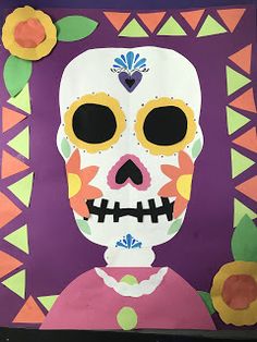 a paper cut out of a skeleton with flowers on it's head and eyes