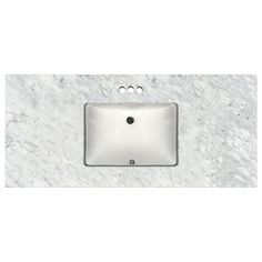 a white sink sitting on top of a marble counter