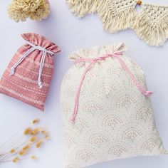 three different types of bags sitting next to each other on top of a white surface