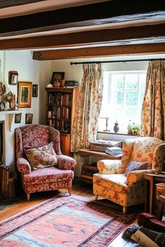 a living room filled with furniture and a fire place under a window next to a fireplace