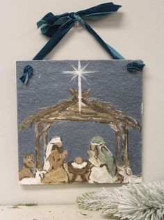 a christmas nativity scene with three wise men and baby jesus in the manger