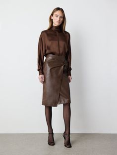 Crafted in buttery soft leather with a draped design, this skirt features a zipper on the back and a front... Brown Leather Pencil Skirt Outfit, Brown Leather Midi Skirt Outfit, Leather Skirt Outfit Work, Dark Brown Skirt Outfit, Leather Midi Skirt Outfit, Long Leather Skirt Outfit, Brown Leather Skirt Outfit, Leather Pencil Skirt Outfit, Brown Ootd