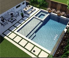 an aerial view of a swimming pool and patio area with tables and chairs around it