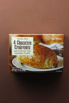 a box of chocolate croissants sitting on top of a table