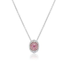 This pendant necklace is crafted in 18 Karat white and rose gold. Featuring a GIA graded pink-purple diamond with SI1 Clarity and totaling 0.50 Carats. Accenting the center diamond are round pink diamonds of VS Clarity totaling 0.07 Carat. Surrounding the diamond halo are round diamonds of VS Clarity and F Color totaling an additional 0.29 Carats. This pendant is on a adjustable chain measuring 16-18 inches long. Pink Oval Platinum Jewelry, Oval Pink Platinum Jewelry, Elegant Pink Oval Pendant Necklace, Pink Platinum Jewelry Gift, Pink Brilliant Cut Platinum Jewelry, Pink Platinum Jewelry With Brilliant Cut, Pink Diamond Necklace For Formal Occasions, Formal Pink Diamond Necklace, Pink Oval Jewelry With Single Cut Diamonds