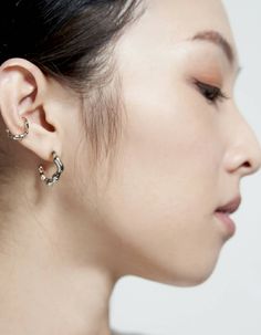 Highlighted by its blobby silhouette, this ear clip is a versatile accessory that fits perfectly with your everyday ensembles. This clip is suitable anyone without piercings and to style with pieces. This product is sold individually.- sterling silver- approx. 1.2cm diameter ear cuff- handcrafted jewelryDelivered in vacuumed package, accompanied by a pouch. Our first collection to build our roots and salute to a form of architecture - Blobitecture. Blobs, instead of emphasizing on the fluidity o Ear Cuff Silver, Ear Cuff Gold, Hoop Earrings Silver, Wax Carving, Gold Ear Cuff, Silver Ear Cuff, Silver Hoop Earrings, Earrings Silver, Ear Cuff