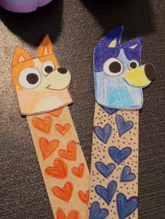 two children's art projects made with paper