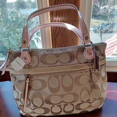 Coach Pop Mtl Sig Sat Glam Handbag Never Used, In Original Packaging. Exterior Color: Cream Light Khaki Interior Color: Light Pink Material: Canvas Original Box: Yes Measurements: 16"X12"X3.5" Cosmetic Condition: New With Retail Tag Attatched. Khaki Interior, Large Leather Purse, Large Handbag, Coach Tote Bags, Pocket Handbag, Brown Leather Bag, Coach Shoulder Bag, Large Handbags, Purse Styles