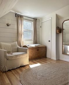 a living room filled with furniture and a window