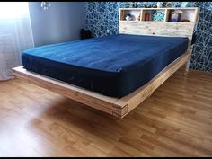 a bed sitting on top of a hard wood floor