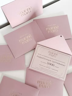 pink and gold wedding stationery with matching envelopes for the couple's names