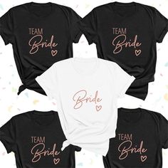 four bride shirts with the words team bride on them in pink and black, sitting next to each other