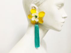 Get ahead of spring, and buy this flower statement earrings for your colorful outfits. These long statement tassel earrings is the perfect accessory for a great spring outfit. Bold and delicacy go together in this flower and tassel earrings. If your wedding is this season, I can create for you the earrings with the ideal color to match with bridesmaids dresses. IMPORTANT INFORMATION Process time -2-5 business days For further information about the shipping to your country, please consult the Sho Handmade Tassel Earrings For Spring, Handmade Earrings For Spring, Spring Handmade Flower Dangle Earrings, Handmade Flower Dangle Earrings For Spring, Bohemian Tassel Earrings With Fringe For Spring, Elegant Yellow Flower Earrings For Summer, Multicolor Fringe Tassel Earrings For Spring, Bohemian Fringe Earrings For Spring, Elegant Green Tassel Earrings For Summer