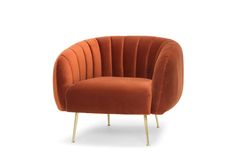 an orange velvet chair with gold legs