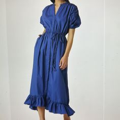 A Braided Tie At The Waist Adds An Extra Element Of Texture To A Woven Cotton Dress Complete With A Ruffled Hemline. 38" To 48" Front Length; 51" Back Length Band Collar Short Sleeves Removable Waist Tie Unlined 100% Cotton In Great Condition, Only Wore 30 Mins Royal Blue Knee-length Dress For Spring, Royal Blue V-neck Spring Dress, Spring Royal Blue Maxi Dress, Royal Blue Spring Maxi Dress, Blue Midi Dress For Day Out, Royal Blue Summer Workwear Dress, Royal Blue Midi Dress For Work In Spring, Chic Blue Cotton Midi Dress, Velvet Maxi Dress