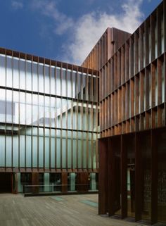 the building is made up of many different types of wood and glass panels on it's sides