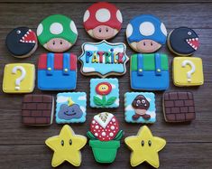 decorated cookies are arranged in the shape of mario's house