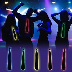 four people standing in front of bright colored lights