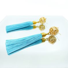 Handmade earrings with filigree locket and premium silk tassels. The intricate filigree locket with long lasting gold plating layer and pearls makes this design blend into either eastern or western style outfit effortlessly. The herb beads in the locket are based on ancient Chinese recipe and made in Taiwan with generations of heritage in traditional Chinese medicine. All the ingredients are 100% plant based from traditional Chinese herbs with unique properties to enhance one’s wellness. ⚜Item S Turquoise Tassel Drop Earrings, Elegant Handmade Turquoise Tassel Earrings, Elegant Turquoise Tassel Earrings, Elegant Blue Tassel Earrings, Blue Tasseled Jewelry As Gift, Elegant Turquoise Earrings With Tassels, Blue Tasseled Jewelry For Gift, Blue Tassel Jewelry Gift, Blue Tassel Jewelry As Gift