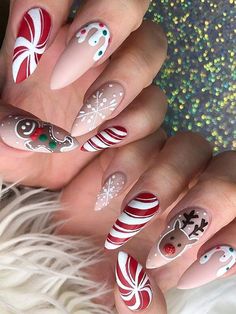 "Red and White Christmas Nails for a Candy Cane Vibe" #CandyCaneNails #RedWhiteNails #HolidayStyle #FestiveFun #ChristmasManicure Themed Nails