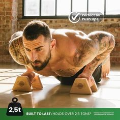 a man doing push ups with wooden blocks in front of him and the words built to last holds over 2 tons