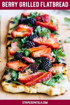 this berry grilled flatbread is loaded with fresh berries, spinach and blackberries