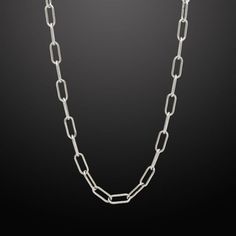 Inspired by classic and original motifs, our modern Paper Clip Link Chain is a versatile accessory that can be dressed up or down. Paper Clip Chain is also a good choice when you want to add a touch of subtle luxury to your everyday look. Paper Clip Link Chain Chain Width: 6mm Wide Chain Length: 26" and 30" Core Material: Stainless Steel Finish: Silver PVD Coated Clasp: Lobster Closure Trendy Silver Chain Necklace For Formal Occasions, Minimalist Link Chain Necklace For Formal Occasions, Minimalist Chain Link Necklace For Formal Occasions, Classic Metal Chain Necklace For Everyday, Formal Minimalist Link Chain Necklace, Classic Paperclip Silver Chain Jewelry, Classic Silver Chain Jewelry With Paperclip Shape, Minimalist Cable Chain Necklace For Formal Occasions, Everyday Cable Chain Link Necklace