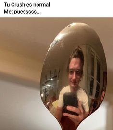 a man taking a selfie in front of a mirror with his reflection on it