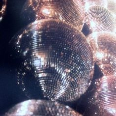 shiny disco balls are stacked on top of each other