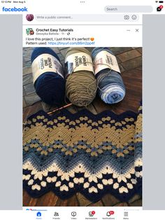 two balls of yarn sitting on top of a wooden floor next to crocheted rugs