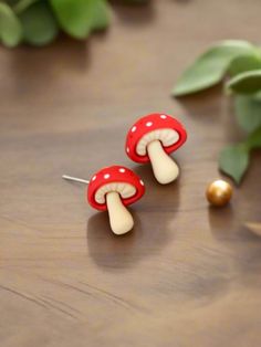 Description Add a touch of whimsy and madness to your style with these Mushroom earrings. Featuring cute mushroom designs, these earrings are perfect for adding a fun and quirky element to your look. Perfect for nature lovers and those who appreciate unique accessories. Details silver plated posts 1" colors: beige, red & white Features One of a kind, fashion jewelry, everyday jewelry Great gift for that special girl, anniversary gift, birthday gift or gift to say how much you care. Check out the Handmade Cute Mushroom Earrings, Cute Handmade Mushroom-shaped Earrings, Cute Handmade Mushroom Earrings, Cute Mushroom-shaped Earrings For Gifts, Whimsical Mushroom-shaped Earrings For Gifts, Fun Mushroom Design Jewelry For Gifts, Fun Mushroom Design Jewelry Gift, Cute White Earrings With Mushroom Design, Cute White Mushroom Design Earrings