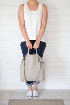 "This natural linen bag is roomy enough for your day's carry, shopping, market, school, college, university, beach, sport, travel, yoga. This shoulder bag is made of softened Baltic natural linen. This linen tote bag is constructed with two different sizes handles. The bag can be or not constructed with a big zippered pocket inside (YKK zipper). ❤ AVAILABLE COLORS: * natural * black ❤ SIZE: * width at top 43 cm (17\") * length 40 cm (16\") ❤ CARE: Hand or machine wash (gentle cycle) in 30-degree Eco-friendly Everyday Double Handle Bucket Bag, Everyday Eco-friendly Large Capacity Hobo Bag, Eco-friendly Large Capacity Hobo Bag For Everyday, Eco-friendly Tote Shoulder Bag For Everyday, Eco-friendly Hobo Bag Tote For Everyday Use, Eco-friendly Everyday Hobo Tote Bag, Eco-friendly Everyday Bucket Bag With Adjustable Strap, Everyday Eco-friendly Tote Shoulder Bag, Eco-friendly Bucket Bag With Adjustable Strap For Everyday