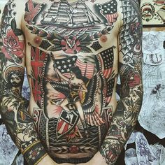 a man with many tattoos on his chest