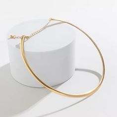 Minimalist Retro Aesthetic Round Torques Collar Necklace – Elegant Metal Choker for Women Step up your fashion game with our Minimalist Retro Aesthetic Round Torques Collar Necklace. This elegant metal choker features a smooth, round collar design that sits beautifully on your neck, adding a touch of sophistication and retro charm to any outfit. Ideal for parties, special events, or simply enhancing your everyday look, this necklace is a versatile accessory that blends trendy fashion with timele Minimalist Metal Choker Necklace, Gold Minimalist Metal Choker, Minimalist Gold Metal Choker, Minimalist Round Clavicle Chain Choker, Minimalist Clavicle Chain Choker, Minimalist Round Metal Choker, Festival Chic, Minimalist Retro, Metal Choker