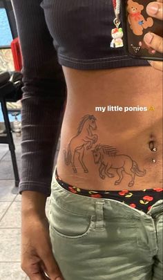 a woman's stomach with tattoos on it and the words, my little ponies