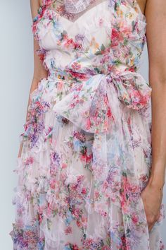 Enhance any special occasion with our Floral Ruffle Trim Halter Gown. The mock crew neck and fitted flare style create an elegant silhouette. The sheer floral tulle print and ruffle detail add a touch of romance, while the matching tulle belt cinches at the waist for a flattering fit. Perfect for summer weddings, wedding parties, or cocktail events. Size & Fit Model Measurements (Model is wearing Size S) Bust: 33" Waist: 26" Hips: 37" Height: 5’8" Bridgerton Garden, Summer Mother Of The Bride Dresses, Dresses Ruffles, Summer Wedding Guest Dress, Spring Summer Wedding, Summer Wedding Guests, Halter Gown, Floral Gown, Cocktail Event