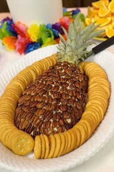 a white plate topped with crackers and a pineapple