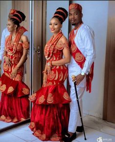 a man and woman dressed in traditional african clothing