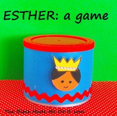 a blue tin with a crown on it sitting on top of a red and green table