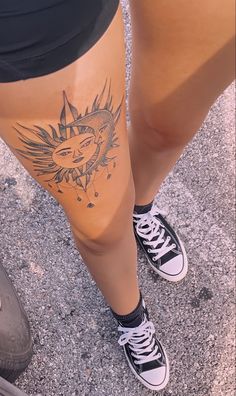 a woman's legs with tattoos on them