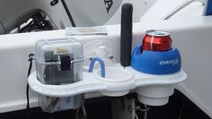 there is a drink holder attached to the side of a boat's front end