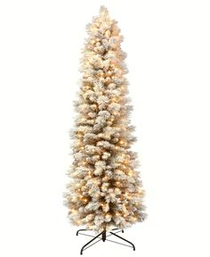 a white christmas tree with lights on it