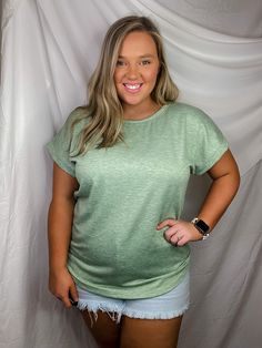 Bundles of Joy Top is a basic top designed with comfort and versatility in mind. It features a relaxed fit with cuffed sleeves and a round neckline in sage green with heather detailing. Perfect for any casual day or night. Try bundling it with jeans and sneakers for effortless style. MODEL INFO:Size LargeBust: 43.5"Waist: 45"Height: 5'2 Versatile Green Relaxed Fit Top, Relaxed Green T-shirt For Everyday, Trendy Green Tops For Everyday Wear, Versatile Green Top For Loungewear, Green Relaxed Fit T-shirt For Layering, Versatile Green Loungewear Top, Relaxed Green Crew Neck Top, Casual Soft-washed Green Tops, Basic Tops