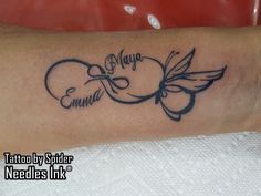 a tattoo on the arm of a woman with two hearts and name written in cursive writing